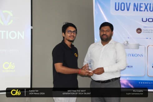 A Techloom.ai team member receiving a token at the UoV NEXUS Career Fair